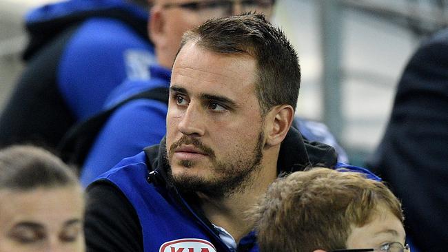 Josh Reynolds of the Bulldogs watches on from the stands.