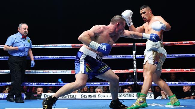 Cauchi watches as Paul Gallen punches Justis Huni. Picture: Cameron Spencer/Getty Images