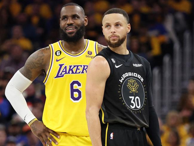 SAN FRANCISCO, CALIFORNIA - MAY 02: LeBron James #6 of the Los Angeles Lakers stands next to Stephen Curry #30 of the Golden State Warriors during the second quarter in game one of the Western Conference Semifinal Playoffs at Chase Center on May 02, 2023 in San Francisco, California. NOTE TO USER: User expressly acknowledges and agrees that, by downloading and or using this photograph, User is consenting to the terms and conditions of the Getty Images License Agreement.   Ezra Shaw/Getty Images/AFP (Photo by EZRA SHAW / GETTY IMAGES NORTH AMERICA / Getty Images via AFP)