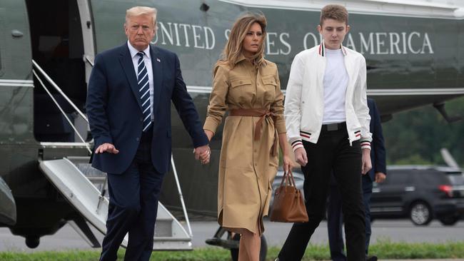 US President Donald Trump (L) walks with First Lady Melania Trump and their son Barron. Picture: Jim Watson/AFP