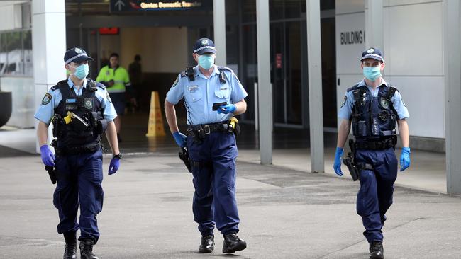 Police at Sydney International Airport on Saturday. Picture: Matrix