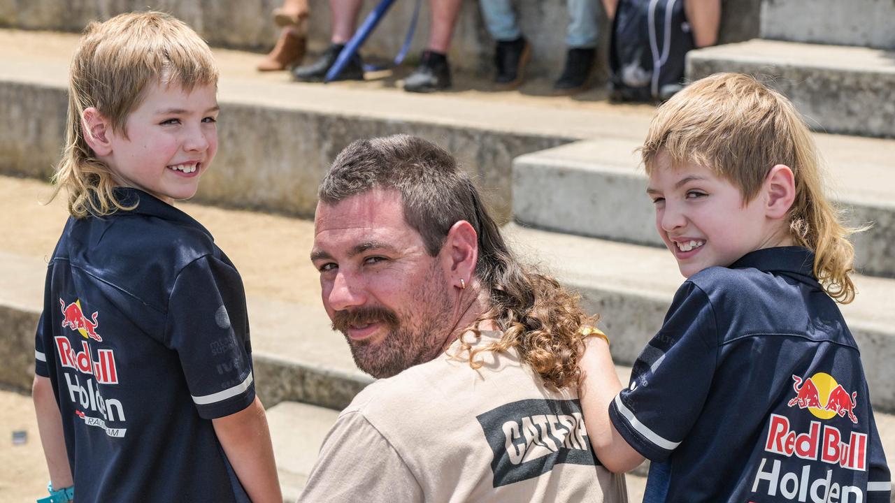 Brett Varnhagen with twin sons Jett and Brody vying for best mullet at the VALO Adelaide 500. Picture: Brenton Edwards