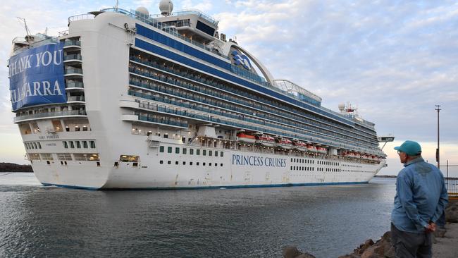 A local resident watches the Ruby Princess set sail from Port Kembla, south of Sydney, on Thursday. Picture: AAP