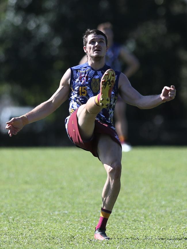 Tyron Rainbird of the Cairns City Lions kicks a goal. Picture: Harry Murtough