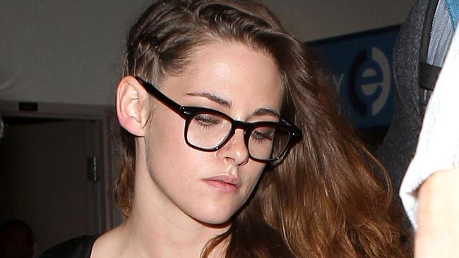 UK CLIENTS MUST CREDIT: AKM-GSI ONLY<BR/> Kristen Stewart makes her way through LAX Airport after returning home on a flight from Paris. The 23-year-old 'Twilight' star wore a one-sided hair braid, white tank top, ripped jeans and a pair of black shoes. Kristen had a busy week in Paris as she was spotted at multiple fashion shows and events for fashion week. <P> Pictured: Kristen Stewart <P><B>Ref: SPL573419 040713 </B><BR/> Picture by: AKM-GSI / Splash News<BR/> </P><P> <B>Splash News and Pictures</B><BR/> Los Angeles: 310-821-2666<BR/> New York: 212-619-2666<BR/> London: 870-934-2666<BR/> photodesk@splashnews.com<BR/> </P>