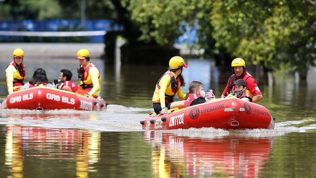 Surf Life Saving pictured rescuing people from the flood waters in Toowong after the heavy rain storms passed through Brisbane, Brisbane 28th of February 2022. (Image/Josh Woning)