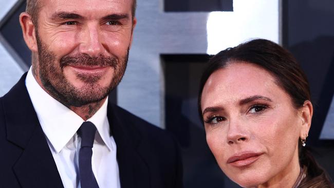 The former England footballer and his wife Victoria Beckham address the claims in their new documentary. Photo by HENRY NICHOLLS / AFP.