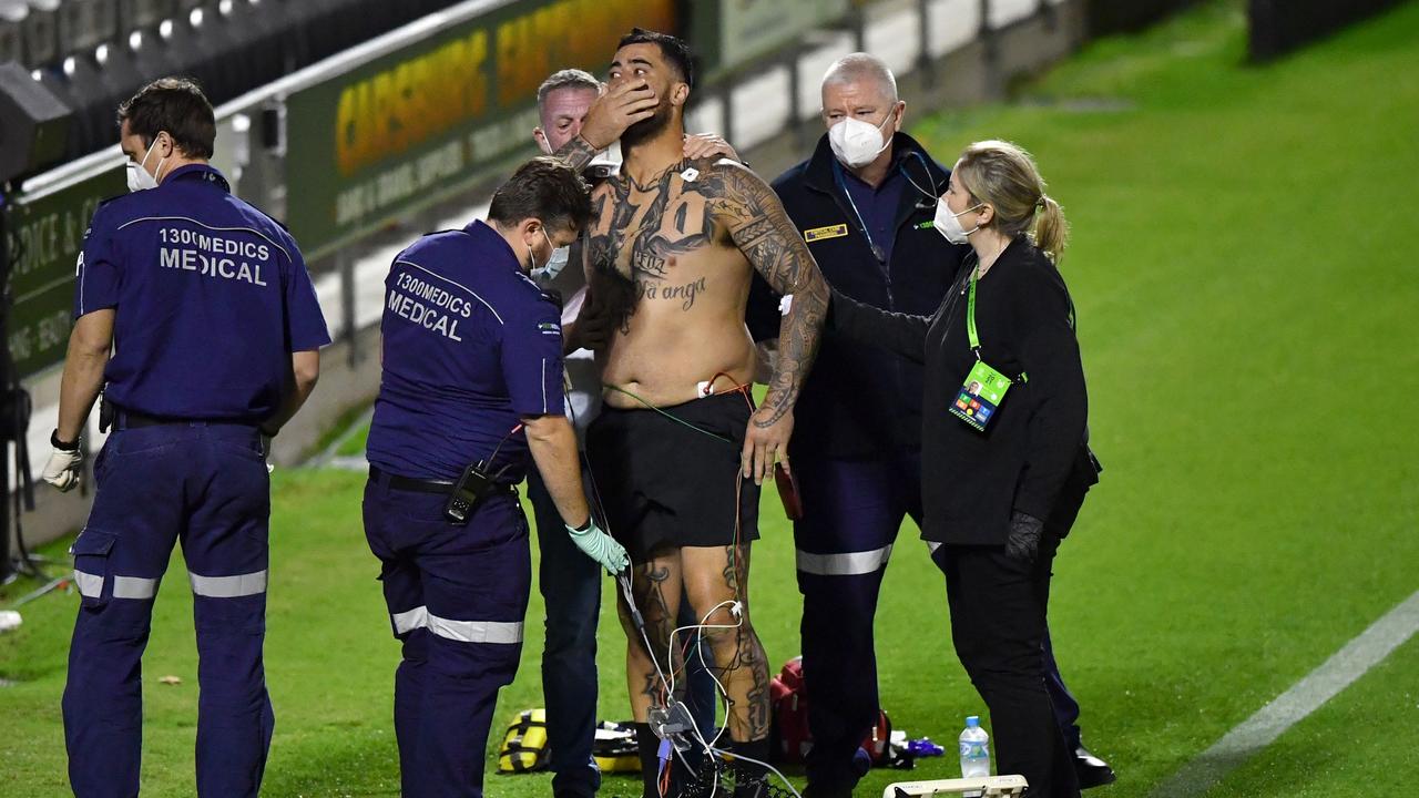 Andrew Fifita is attended to by medical staff. (AAP Image/Darren England).