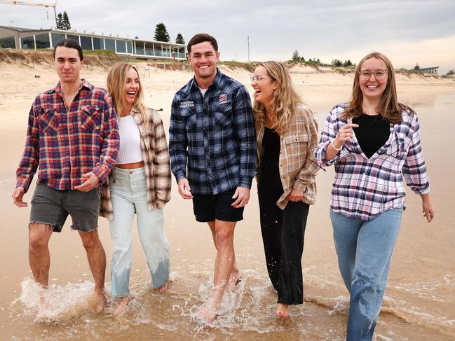 The Daily Telegraph.  5.8.2024. Brandon Shimooka, Lily Carr, Kyle Flanagan, Maya Carr and Kyla-Rose Booth. Pictured on Elouera Beach.  Flaunt your flanno this August, to support farmers in need!.  Picture: Rohan Kelly