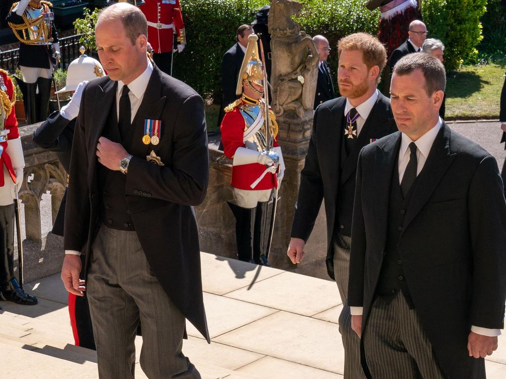 Prince William, Prince Harry and Peter Phillips enter the chapel. Picture: AFP