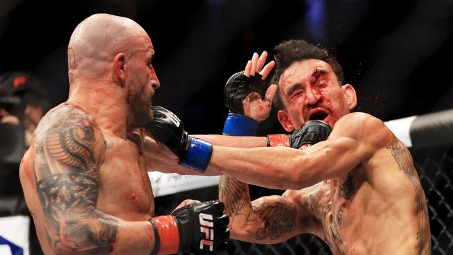 Alexander Volkanovski proved far too strong for Max Holloway, cutting him open in the second round and securing his place as the featherweight GOAT. Picture: Getty Images