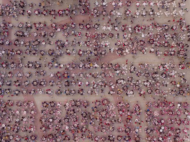 Thousands of people converge on Xuyi County every summer for the annual crayfish eating festival. With rapidly expanding incomes, Chinese consumers are demanding increasing amounts of protein and dairy products in their diet. Picture: George Steinmetz for National Georgraphic/World Press Photo