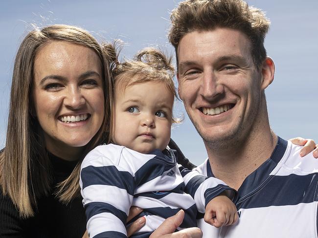 GEELONG, AUSTRALIA - OCTOBER 28: Josh Jenkins poses for a photograph with his wife Hannah, and daughter Lottie, during a media opportunity after signing a contract with the Geelong Cats at GMHBA Stadium on October 28, 2019 in Geelong, Australia. (Photo by Daniel Pockett/Getty Images)