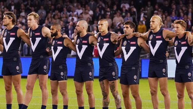 Dustin Martin (centre) and Victorian teammates line up during the Charity State of Origin for Bushfire Relief match between Victoria and All Stars in 2020. (AAP Image/Michael Dodge)