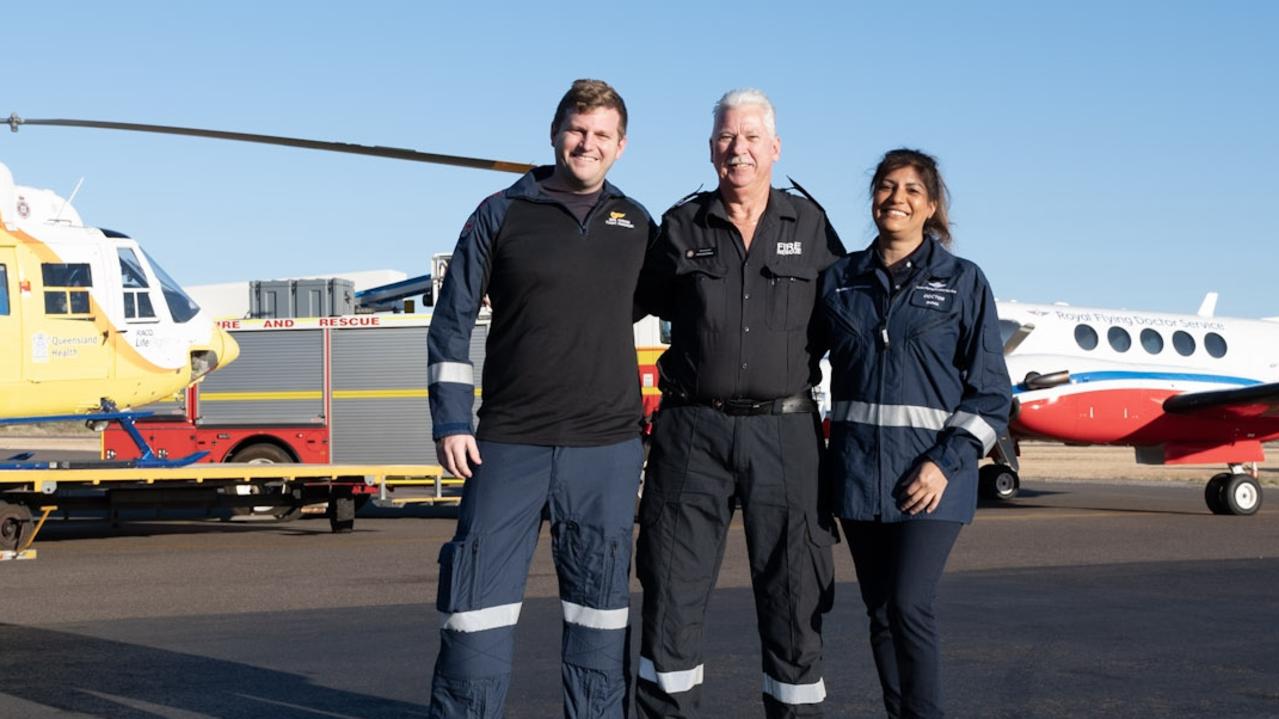 LifeFlight QAS flight paramedic Jake Graham, patient and Mount Isa senior fire fighter David McCrindle and RFDS Doctor Shima Ghedia.