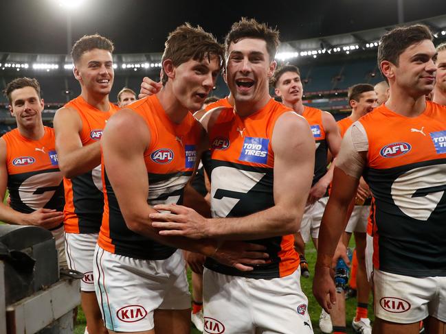 Lachie Ash (second from left) is loving his time at the Giants after a difficult first season. Michael Willson/AFL Photos via Getty Images