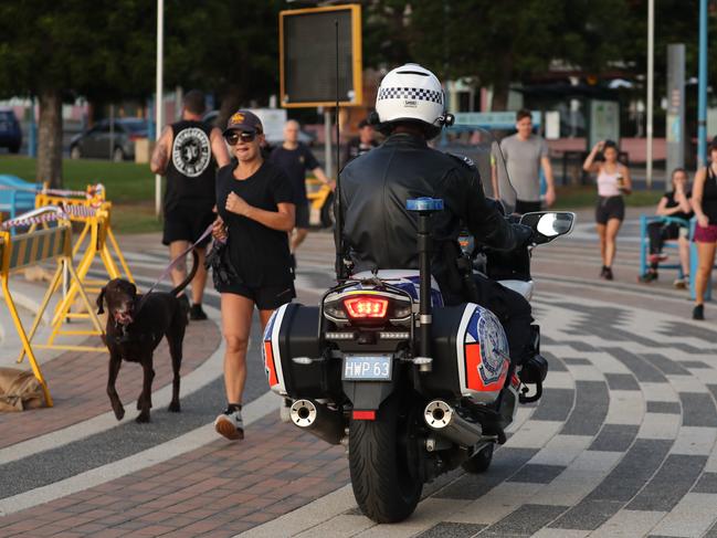 A police motorcyclist patrols Coogee beach. Picture: John Grainger