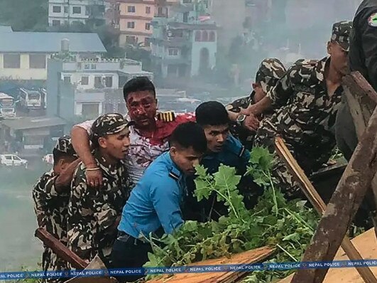 The pilot Captain Manish Ratna Shakya survived after his cockpit broke off on impact. Picture: Nepal Police/AFP via Getty Images