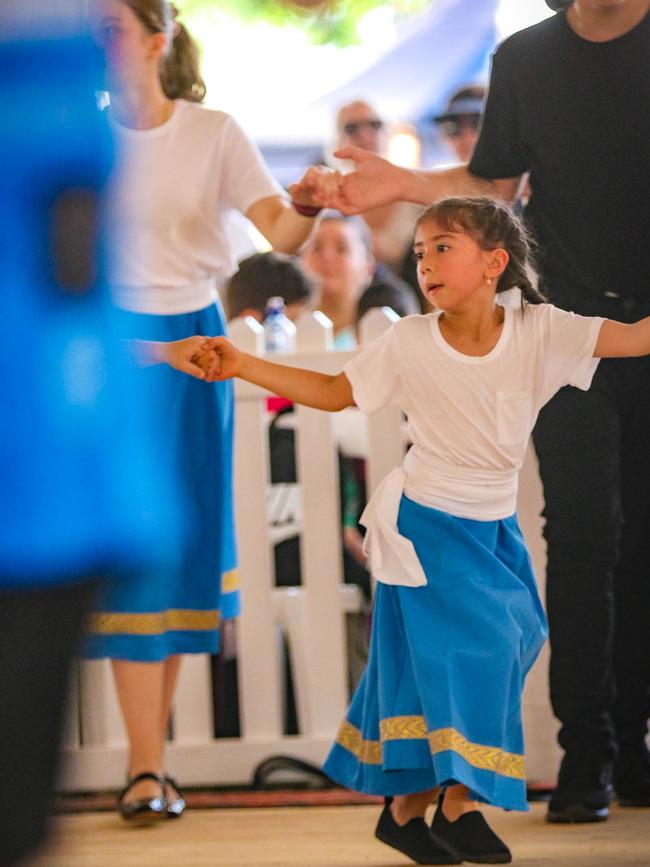 Maria Koukouvas 6 with the OPA dancers at the 2021 Greek Glenti Festival on the Esplanade. Picture: Glenn Campbell