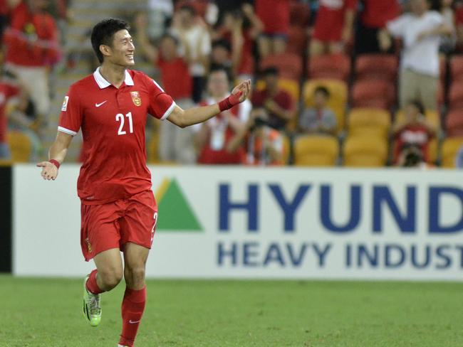 China's Yu Hai gestures to the crowd as he celebrates after scoring a goal during the first round soccer match of the AFC Asia Cup between China and Saudi Arabia in Brisbane, Australia, Saturday, January 10, 2015. (AP Photo/Steve Holland)