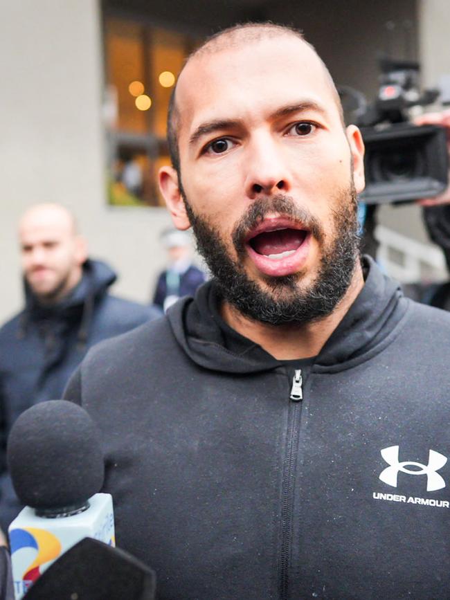 Tate talks to media in Romania after his detention for human trafficking. Picture: MIahai Barbu/AFP)