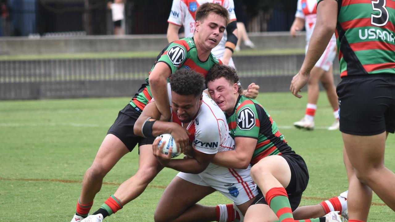 Matthew Humphries (left) and Harrison Rooke bring down Cyrus Stanley-Traill. Picture: Sean Teuma