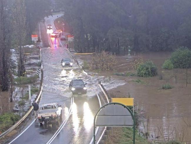 Several cars were spotted trying to drive through floodwaters at Wiseman Ferry Rd in Cattai. Picture: LiveTraffic NSW