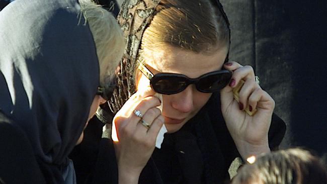 Widow Svetlena Bernovski at Gennadi Bernovski’s burial site at Southport, after he was shot and killed at their Benowa Waters home. Picture: Adam Ward