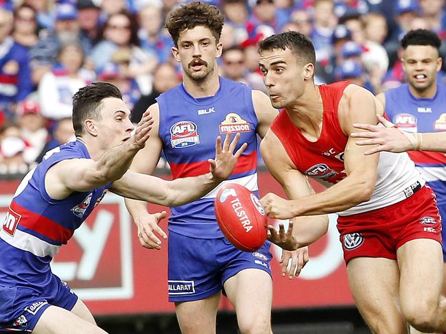 2016 AFL Grand Final match between the Western Bulldogs and the Sydney Swans at the Melbourne Cricket Ground (MCG), Melbourne, Australia on October 1, 2016.    Sydney's Xavier Richards clears the ball Picture: David Caird