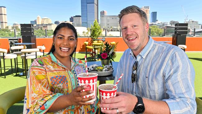 SACA members John Hinge and Hannah Douglas-Hill enjoy Pimms and oysters in the new Village Green-style members area on level 5 of the Riverbank Stand. Picture: Brenton Edwards