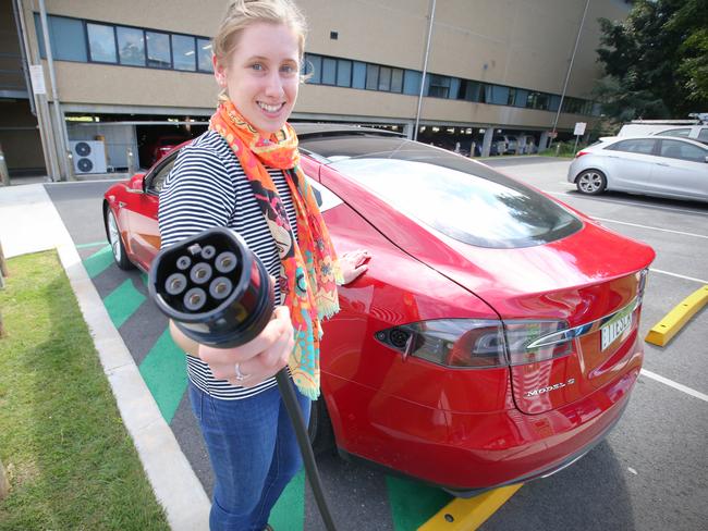 Claire Sotiriadis 20 with electric Tesla car to go with story on new report on switching the national car flee to electric.