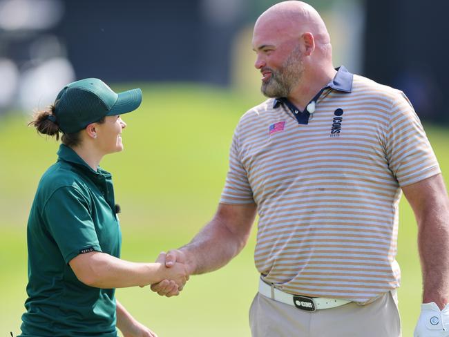 JERSEY CITY, NEW JERSEY - JULY 01: Ash Barty and Andrew Whitworth shake hands following the Singles Matches during Day Two of the ICON Series at Liberty National Golf Club on July 01, 2022 in Jersey City, New Jersey. (Photo by Mike Stobe/Getty Images)