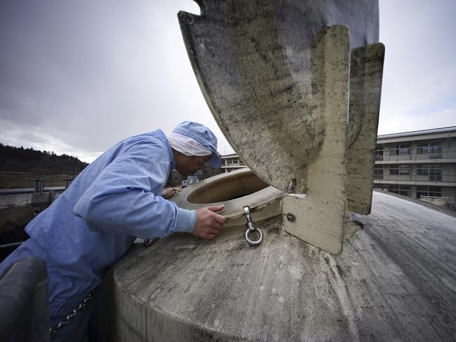 A worker of Yagisawa Shoten Co. checks a soy sauce tank of the company's new factory in Ichinoseko.