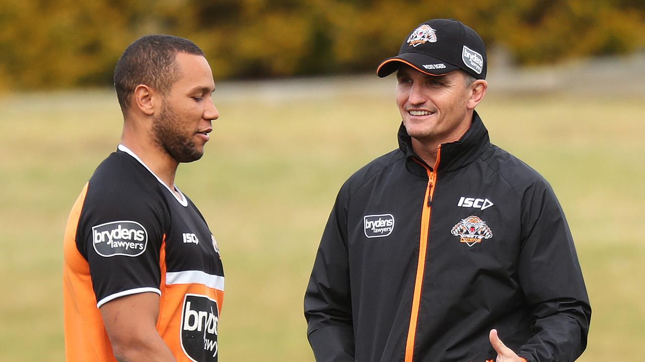 Wests Tigers NRL coach Ivan Cleary with Moses Mbye during a closed training session at Concord Oval, Sydney. Picture: Brett Costello