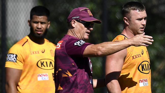 Broncos coach Kevin Walters gives instructions to Jake Turpin at training. Picture: Albert Perez/Getty Images