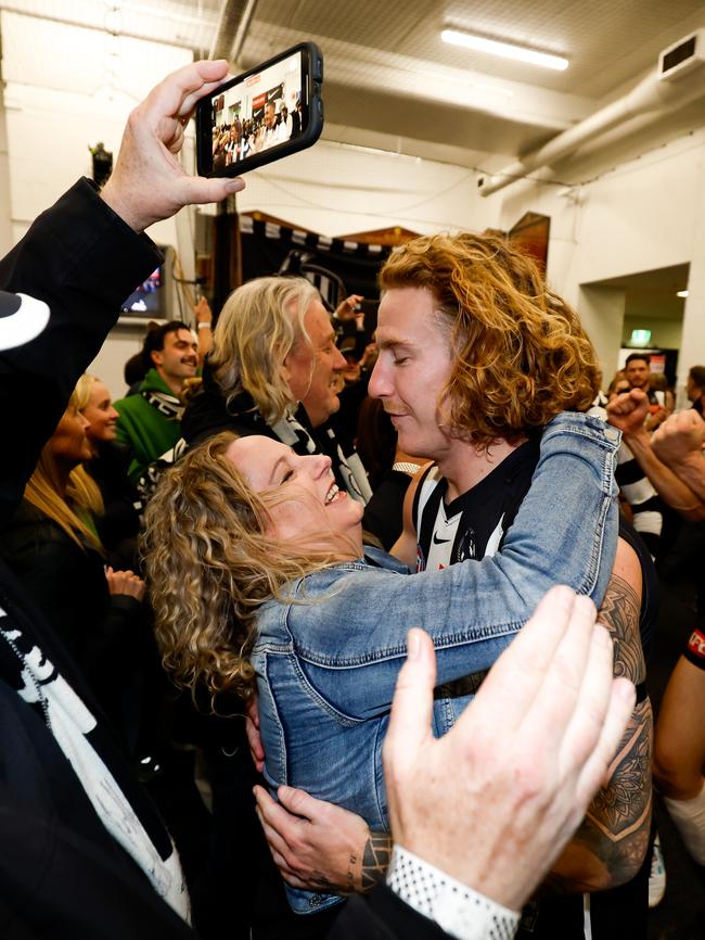 McCreery celebrates with his mum after the preliminary final win over GWS. Picture: Dylan Burns/AFL Photos via Getty Images