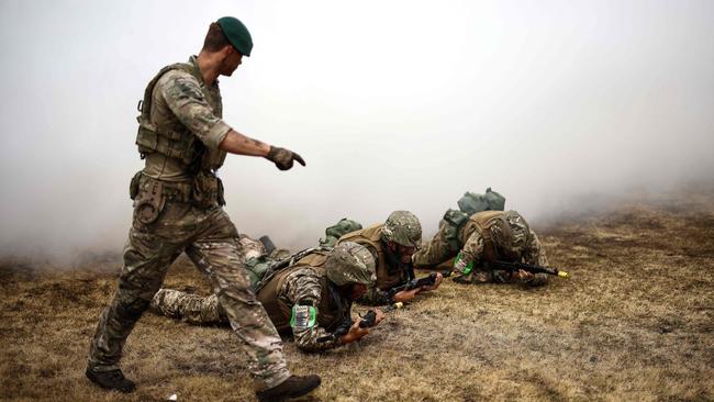 Ukraine Army recruits in a training session with members of Britain's Royal Marines at a training base in southern England last week. Picture: AFP