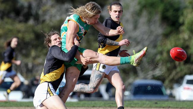 Jesse Cherry of Mitcham tackles Austin Smith of Mooroolbark last Saturday. Picture: George Salpigtidis