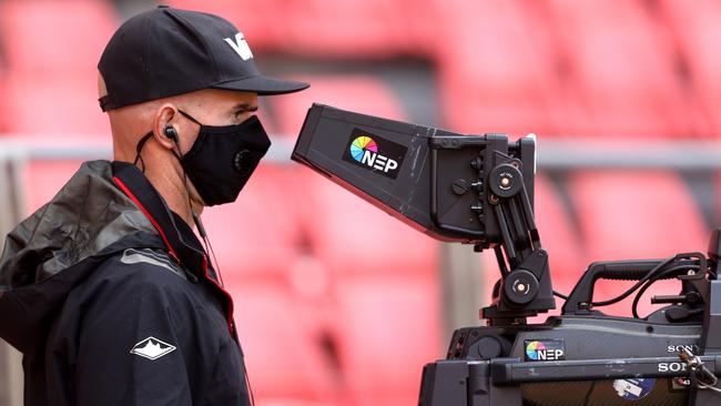 A cameraman takes coronavirus precautions. Picture: Phil Hillyard