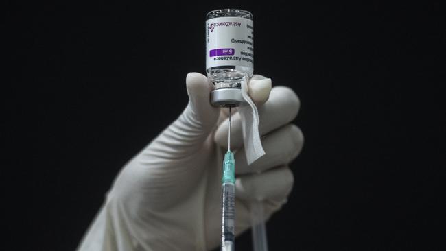 A health worker prepares a syringe for administering the Vaxzevria Covid-19 vaccine. Picture: Getty Images