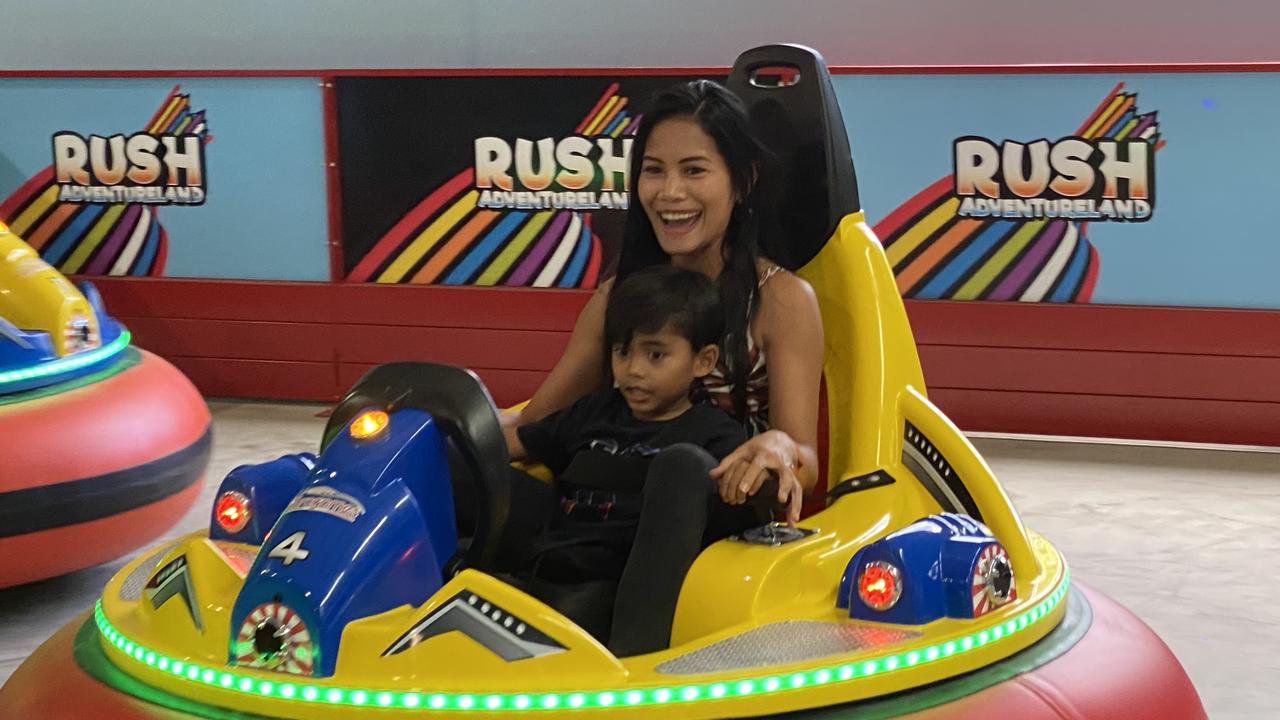 Irene Lahab and her son Joseph Makiri, 4, enjoy the new Rush Adventureland at Sunshine Plaza.