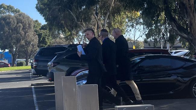 The Jonker brothers, Jamie and Luke (middle), leaving Sunshine Magistrates' Court on Tuesday.