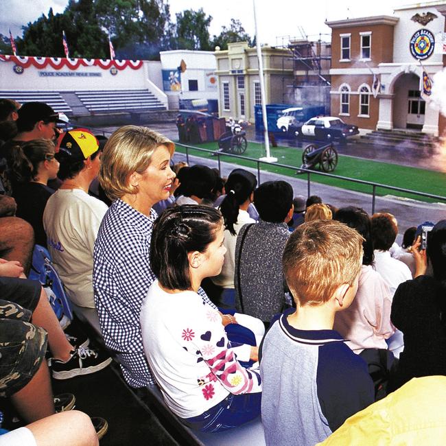 Visitors to Movie World on the Gold Coast watch exploding police academy cars in 2001
