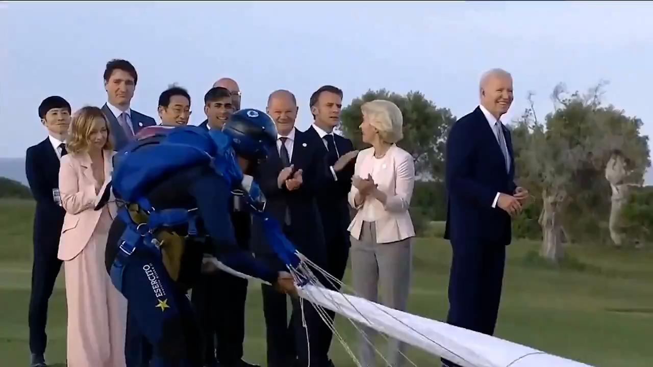 US President Joe Biden starts wandering off from the group of G7 leaders.