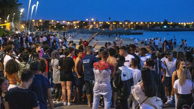 Crowds gather at St Kilda beach on Sunday night. Picture: Wayne Taylor