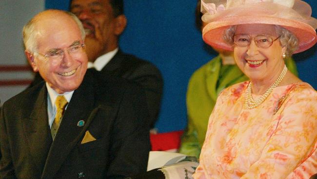 Queen Elizabeth II and former Australian Prime Minister John Howard at the opening session of the Commonwealth Summit in Abuja, Nigeria in 2003. (AP Photo/Saurabh Das, POOL)