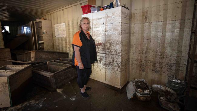 Jodie Reynolds inspects a shipping container that once held her supply of linen. Picture Emma Brasier