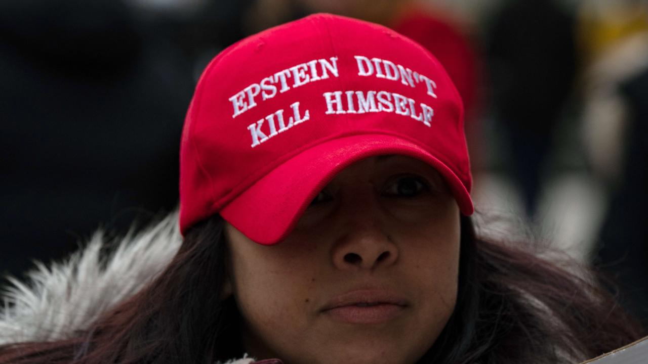 People gather to protest human trafficking at the Thurgood Marshall United States Courthouse where the trial of Ghislaine Maxwell is being held.