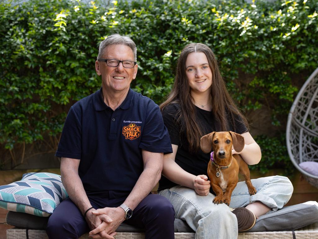 Wayne Holdsworth and daughter Daisy, 15, with Shandy the dog, at home in Melbourne. Picture: Jason Edwards