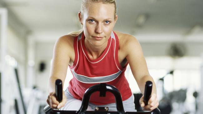 Portrait of a young woman on exercise bike in gym. Picture: Supplied